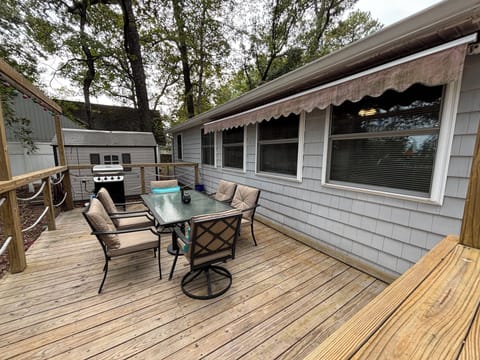 Back deck with dining table for 6 and propane grill