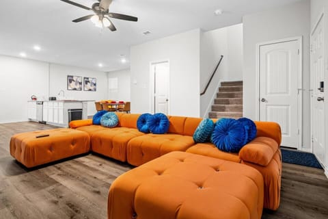 Spacious living area with a bright sectional couch, ideal for relaxing with family or friends.  Easy access to upstairs bedrooms, with a downstairs bathroom and mattresses available for guests who prefer no stairs.