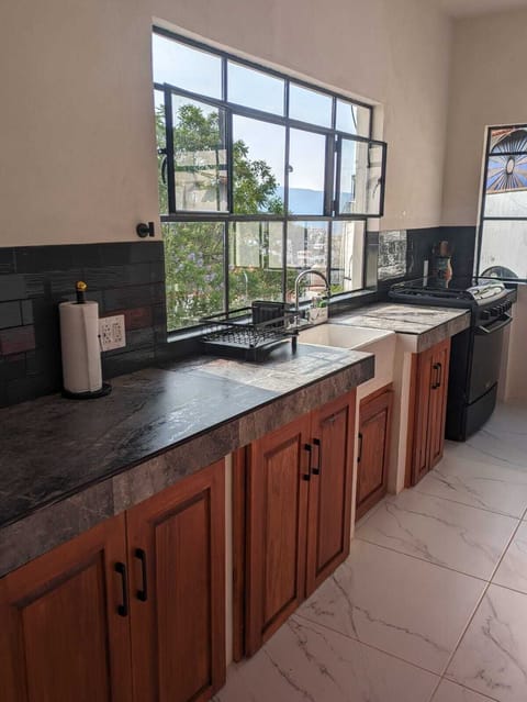 Kitchen is well equipped with convection toaster oven, coffee maker, and more.