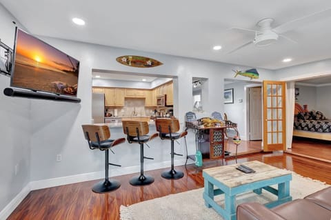 Sip, chat, and relax in our airy Florida sunroom with inviting bar seating.