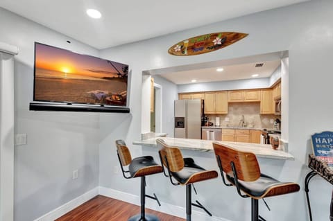 Pull up a chair—our bar seating flows effortlessly into the kitchen.