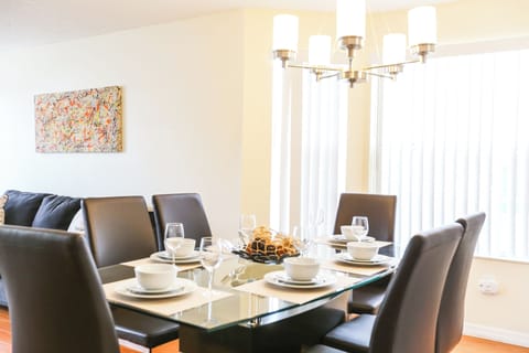 Comfortable dining space with seating for six, situated just off the kitchen—perfect for shared meals or game nights with family and friends.