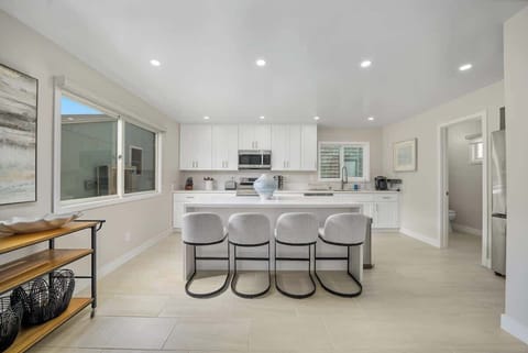 Newly renovated kitchen with Keurig, seating for 4 and all the supplies you need to have a meal before the beach