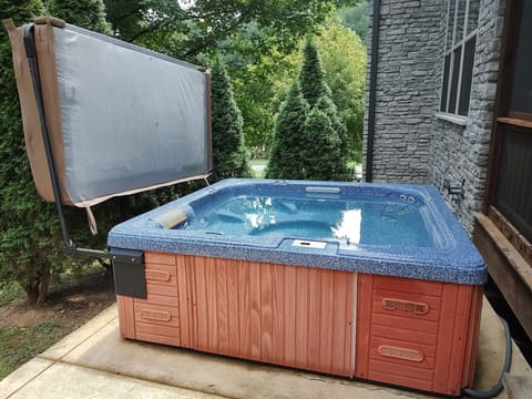 Hot tub with attached cover.