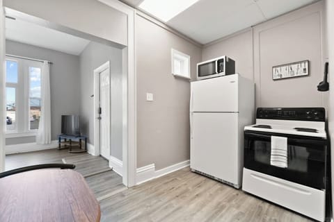 Our well-equipped kitchenette features a refrigerator, microwave, stove, and all the basic essentials for your cooking needs.