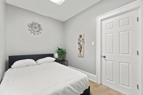 The bedroom features a plush queen-sized bed for ultimate comfort and relaxation