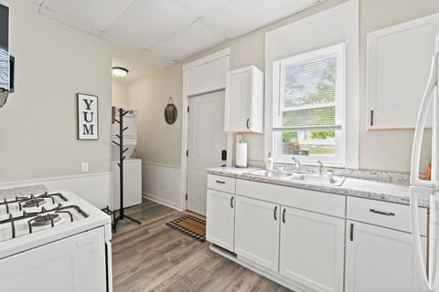 The kitchenette is well-stocked with a fridge, stove, and microwave for all your culinary needs.
