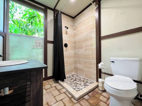 Outdoor bathroom located by the pool.