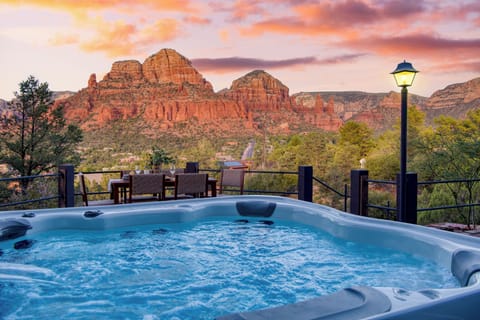 Unwind in the hot tub while enjoying mountain views.