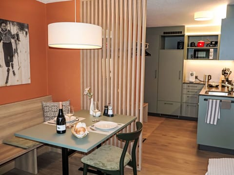 Furniture, Interior Design, Wood, Flooring, Floor, Table, Lighting, Ceiling, Light Fixture, Room