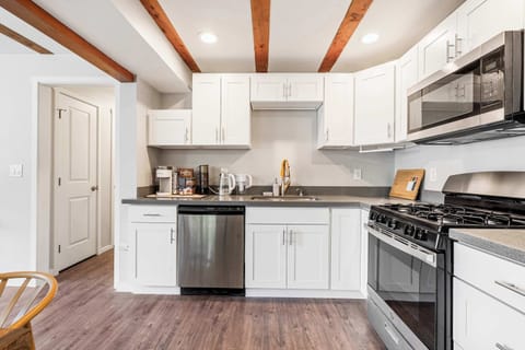 Chef's kitchen with charm showcasing stainless steel appliances.