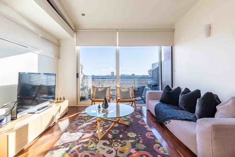 Living Room - Featuring flat screen TV, Bose sound system and an abundance of natural light.