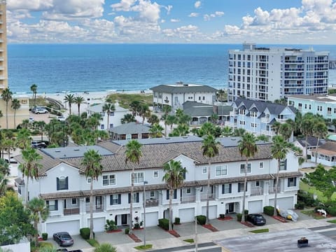 Stunning coastal townhomes set just steps from the ocean with beautiful beach views.
