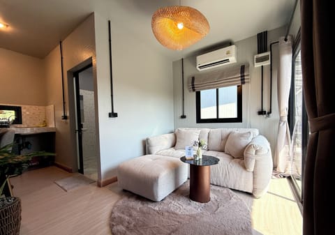 Relax on a comfy sofa in a bright, modern living area with soothing décor.