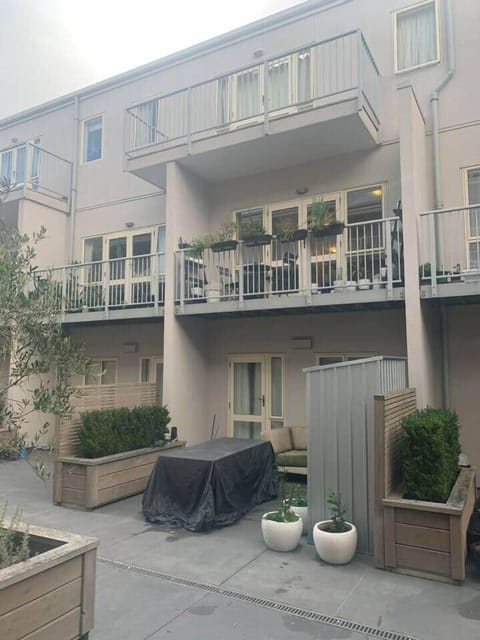 Outside in the courtyard looking in to the double level apartment 