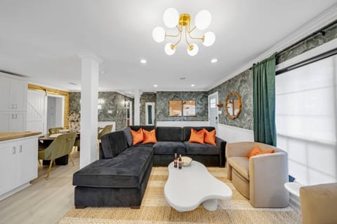 Spacious living room with modern décor and comfy seating for everyone.
