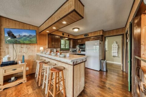 Make yourself at home in the kitchen, featuring a spacious counter, refrigerator, and all the essential amenities to prepare your favorite meals with ease