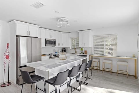 Modern Kitchen: Cook and mingle in this stylish space with sleek bar seating and bright accents!