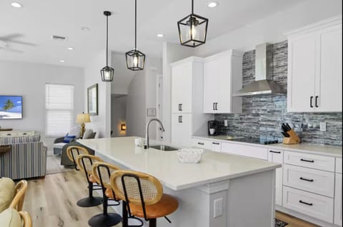 Cook and dine comfortably in the full kitchen with island seating. Enjoy a thoughtful welcome basket with coffee, chocolates, dishwasher pods, and helpful guide!