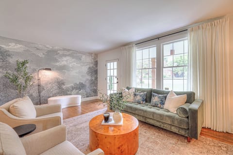 Living Room filled with natural light and curtains for privacy