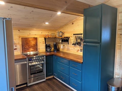 Full kitchen with large fridge, dishwasher, stove, pantry, complimentary coffee