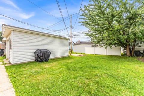 Large backyard lawn w/ grill area & plenty of space for outdoor fun