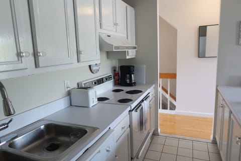 Fully loaded kitchen.  Hall to Living room