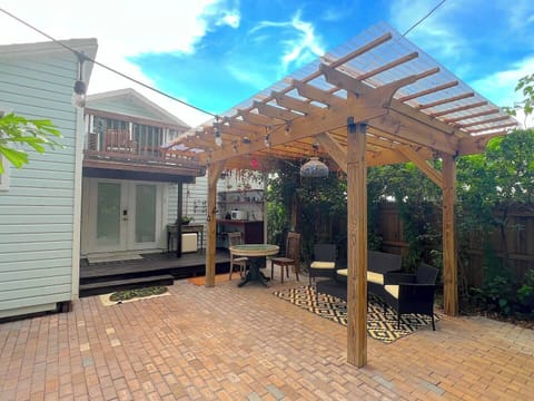 Welcome to your Private Tiny Home Patio Hideaway! This spacious courtyard under a pergola and string lights is perfect for morning coffee, evening chats, or simply unwinding in your own private outdoor retreat.