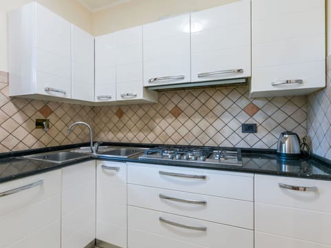 Kitchen, Countertop, Major Appliance, Flooring, Kitchen Stove, Kitchen Appliance, Interior Design, Stove, Cabinetry, Gas Stove