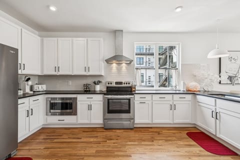 Kitchen: Start your day with coffee and sunshine in this inviting kitchen. A perfect space to gather and create culinary memories.