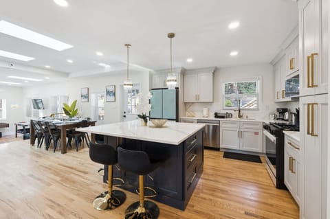 Open concept LivingRoom w/ TV,Kitchen w/ island,new appliances,Dining -MainLevel