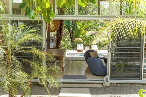 The home is open air, with glass walls that open wide.  Every room has AC. 
