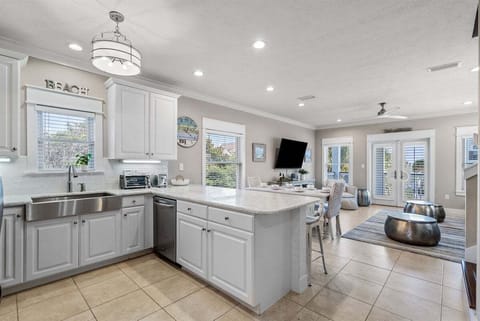 Seamless flow between cooking and lounging areas, perfect for family togetherness.