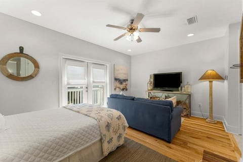 open concept queen bed in the Carriage House