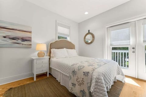open concept queen bed in the Carriage House