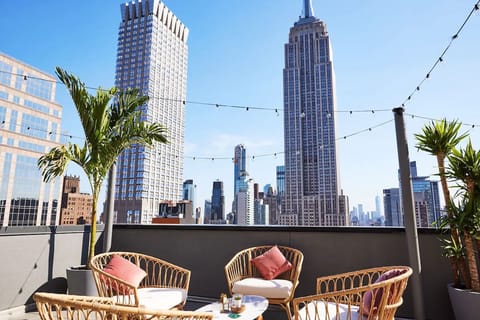 Unwind on the rooftop with skyline views and cocktails.
