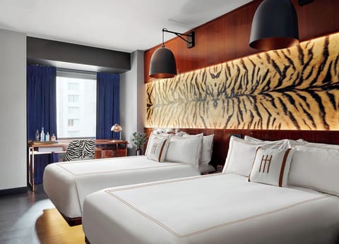 Stretch out together in twin beds with standout designer décor.