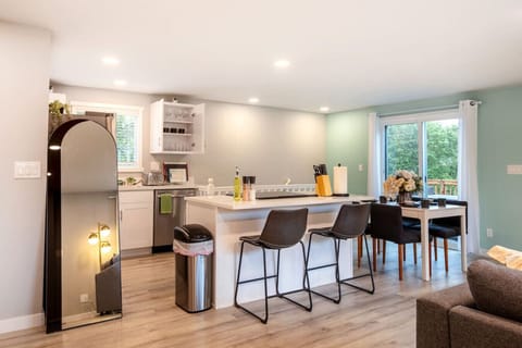 Our open-concept dining area seamlessly blends with the living space, creating a perfect setting for shared meals and conversations #SocialGathering #MemorableMeals