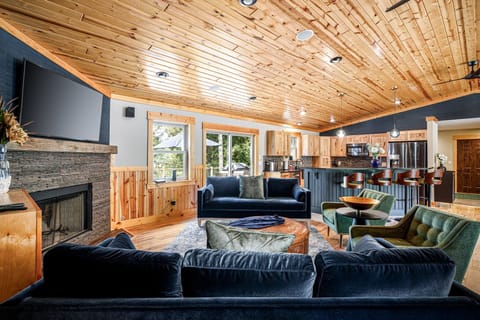 Living Room: Room with vaulted ceilings and fireplace