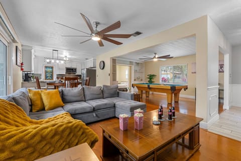 Cozy open-concept living area featuring comfortable sofas and warm, modern décor.