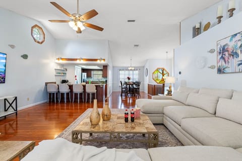 The star of the room is the light cream L-shaped sectional, spacious enough to stretch out solo or gather the whole group for a movie night.