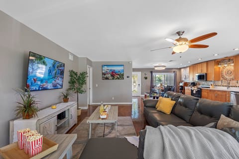 Designed with comfort in mind, the roomy sectional and multiple tables make this the ultimate hub for family activities.