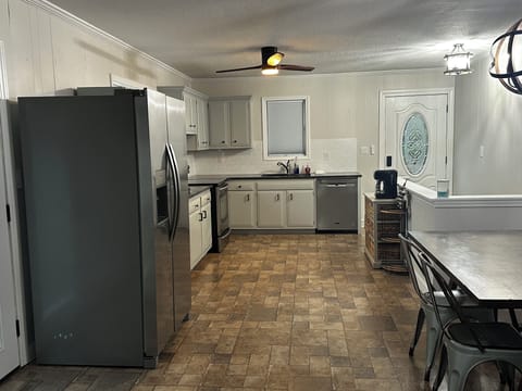 Full kitchen and dining area.