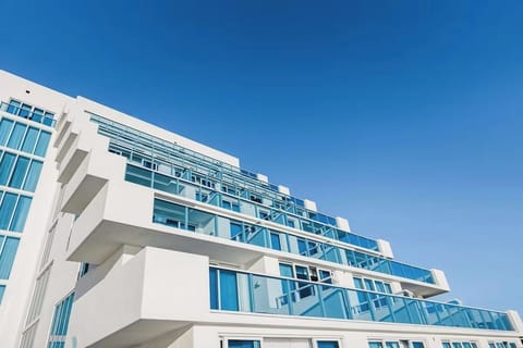 Admire crisp modern lines against endless blue sky.