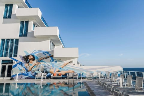 Admire bold resort design while you lounge by the water.