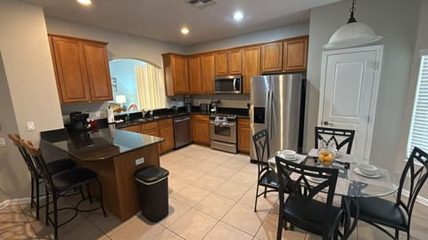 Open kitchen and dining area, perfect for family meals and gatherings.