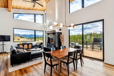 Great room with 19 ft cedar ceilings and wood fireplace.  Incredible views!