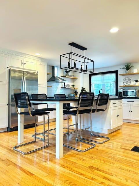 Well stocked chef’s kitchen with huge kitchen counter