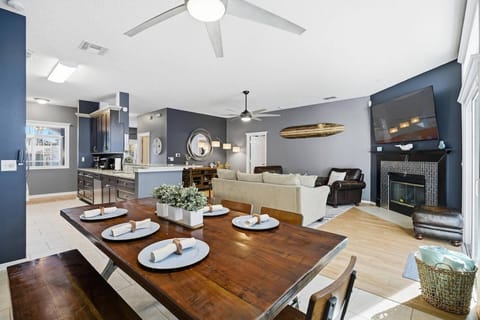 Bright dining area with seating for 7, with additional counter seating for 4, offering pool and lanai views for relaxed, indoor-outdoor living.