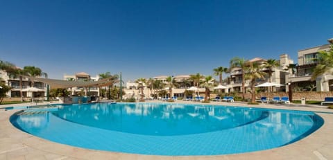 Stretch out poolside and cool off in sparkling blue water.